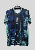 Brésil (Concept / Jaguar) Noir et bleu, tête de jaguar imposante, motifs de feuilles de palmier turquoise et logos Nike/CBF centrés. GoalKits