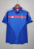 France Domicile 2006 : Bleu, bande rouge dégradée, col en V, technologie Teamgeist. GoalKits