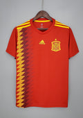 Espagne Domicile 2018 : Rouge avec motif de diamants graphiques jaunes, bleus et rouges sur le côté droit. GoalKits