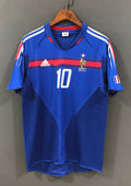 France Domicile 2006 (Vierge) : Bleu, bande rouge dégradée, technologie Teamgeist. GoalKits