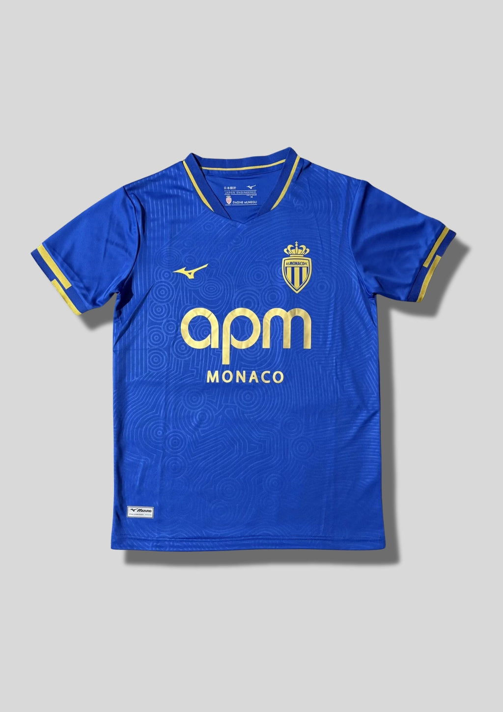 AS Monaco extérieur 2024-2025 : maillot bleu roi Mizuno orné de motifs géométriques ton sur ton GoalKits