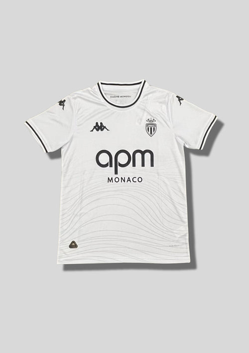 AS Monaco "Third" 2024-2025 : maillot blanc immaculé avec des motifs ondulés gris clair sur le bas du torse, logos et sponsor apm MONACO en noir. GoalKits