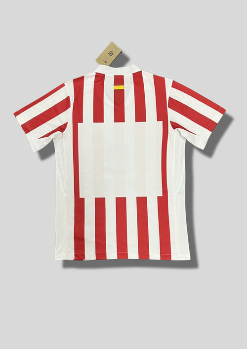 Atlético de Madrid Domicile (2024/25) : Le design classique à rayures verticales rouges et blanches. GoalKits