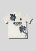 Real Madrid : Maillot d'entraînement / Édition Spéciale Y-3 (Yohji Yamamoto) – Blanc avec deux grandes roses noires dessinées à la main sur l'épaule et le flanc. GoalKits
